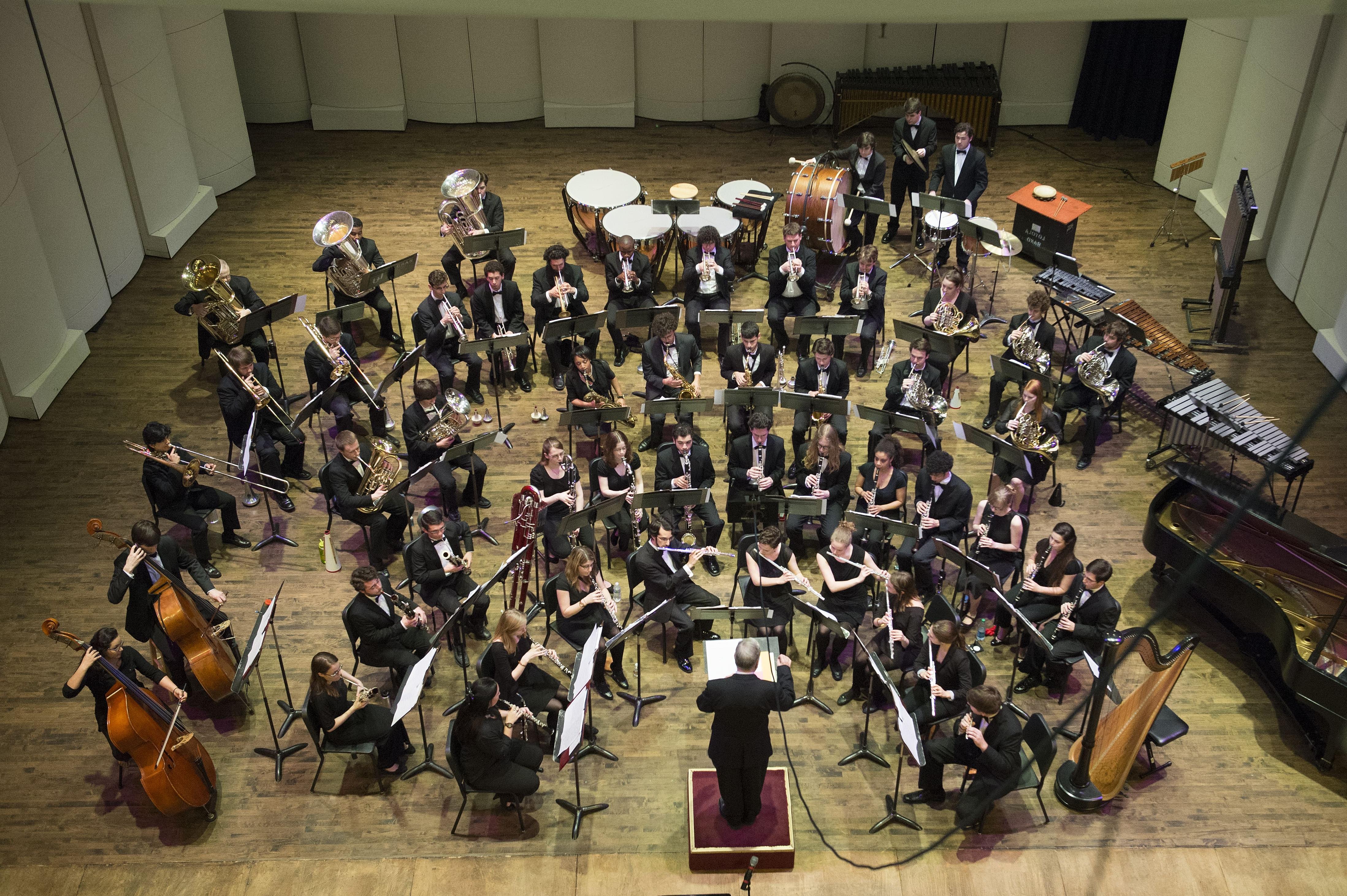 An overhead photo of the Loyola Wind Ensemble under the direction of Colonel John Bourgeois.